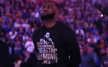 OAKLAND, CA - JANUARY 16:  LeBron James #23 of the Cleveland Cavaliers wears a shirt honoring Martin Luther King Jr. during the playing of the National Anthem before their game against the Golden State Warriors at ORACLE Arena on January 16, 2017 in Oakland, California. NOTE TO USER: User expressly acknowledges and agrees that, by downloading and or using this photograph, User is consenting to the terms and conditions of the Getty Images License Agreement.  (Photo by Ezra Shaw/Getty Images)