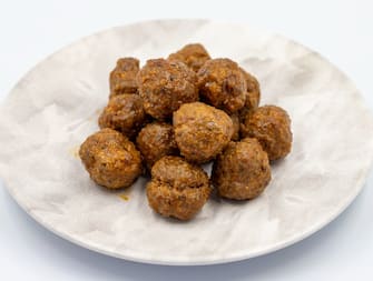 Baked homemade meatballs on a white background. Local name misket kofte. close up