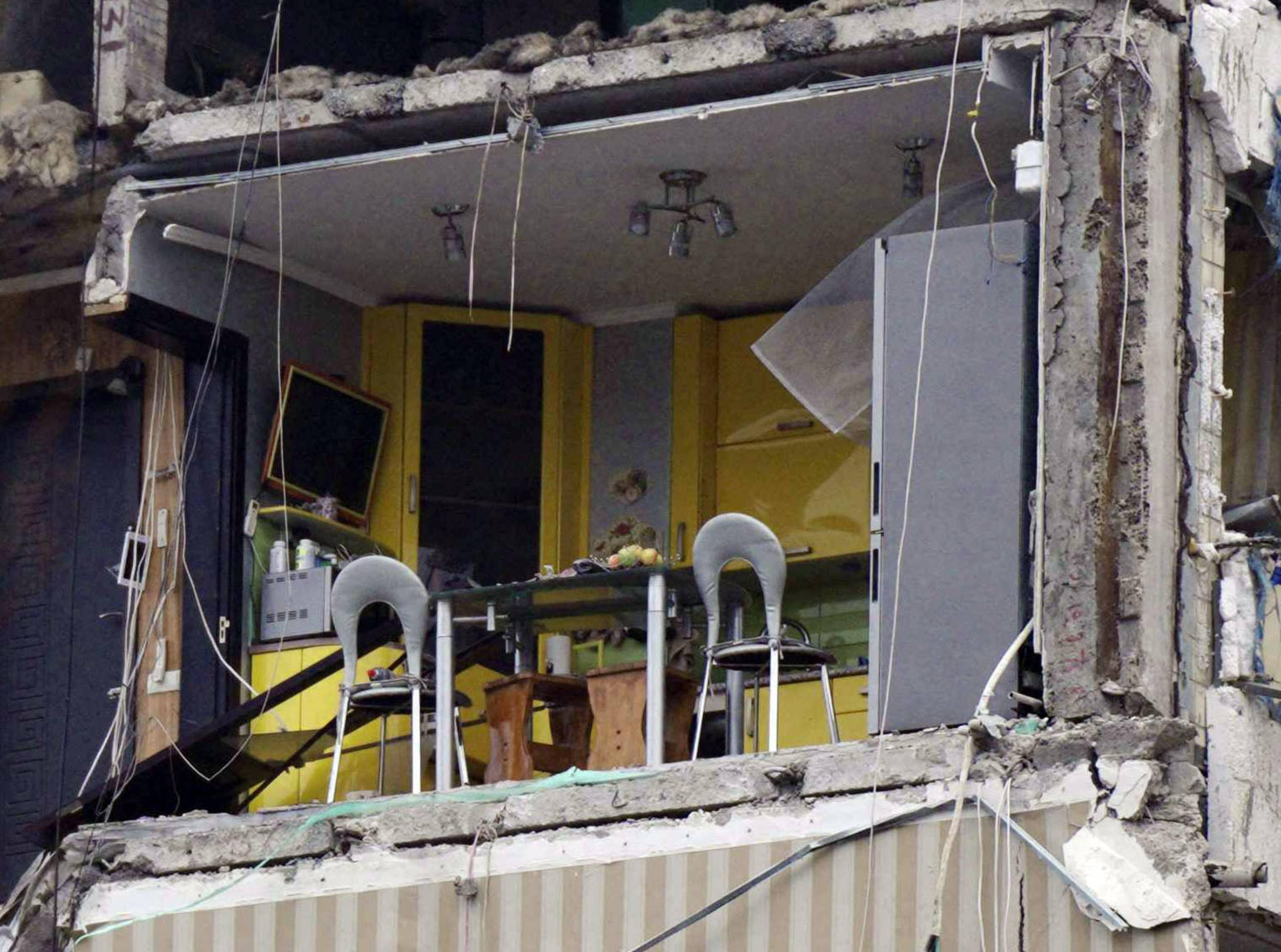 A photograph shows a residential building destroyed after a missile strike, in Dnipro on January 16, 2023, amid the Russian invasion of Ukraine. - According to State Emergency Service report, as of 1:00 pm on December 16, 40 people died, including 6 children; 75 people got injured, including 14 children; 39 people were rescued, including 6 children; the fate of 34 people is still unknown. (Photo by vitalii matokha / AFP)