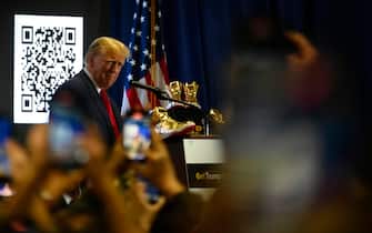 Former U.S. President Donald Trump speaks on stage to promote self-branded golden sneakers during an appearance at SneakerCon at the Pennsylvania Convention Center, in Philadelphia, PA, USA on February 17, 2024. (Photo by Bastiaan Slabbers/Sipa USA)