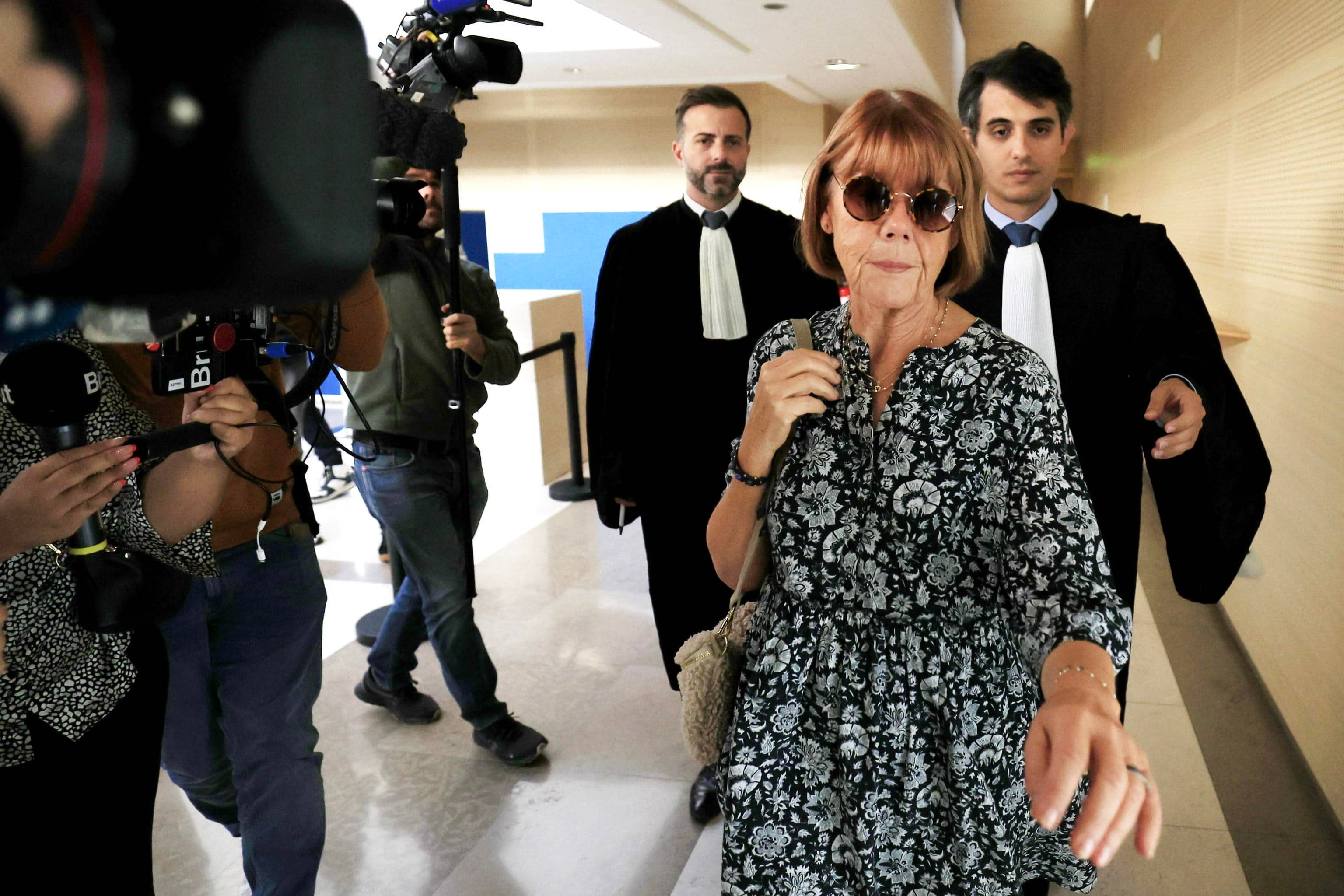 epa11609180 Gisele Pelicot (2-R), escorted by her lawyers Stephane Babonneau (R) and Antoine Camus (C), exits the criminal court following a hearing during her former husband's rape trial, in Avignon, southern France, 17 September 2024. Gisele Pelicot's ex-husband, Dominique Pelicot, is accused of drugging and raping her while she was unconscious. He is also charged with offering her to dozens of men at their home in Mazan, France between 2011 and 2020. Fifty other men are facing trial for their alleged involvement. Pelicot could face a maximum sentence of 20 years in prison if convicted. The trial resumed on 17 September after a delay due to Dominique Pelicot's health concerns.  EPA/GUILLAUME HORCAJUELO