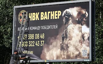 RUSSIA, ST PETERSBURG - JUNE 24, 2023: Removing a banner of PMC Wagner by Koltushskoye highway. Peter Kovalev/TASS/Sipa USA