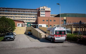 Savigliano, Cuneo, Italy - August 09, 2022: ambulance of the Red Cross of Savigliano that climbs the ramp towards the emergency room of the SS Annunzi