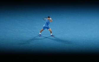 epa10437909 Novak Djokovic of Serbia in action during the Men s Singles Final against Stefanos Tsitsipas of Greece at the 2023 Australian Open tennis tournament in Melbourne, Australia, 29 January 2023.  EPA/LUKAS COCH AUSTRALIA AND NEW ZEALAND OUT