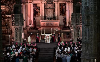 Pope Francis (C) celebrates vespers at the Jeronimos Monastery in Lisbon, during his five-day visit to attend the World Youth Day (WYD) gathering of young Catholics, on August 2, 2023. Pope Francis arrived in Lisbon today to gather with a million youngsters from across the world at the World Youth Day (WYD), held as the Church reflects on its future. The 86-year-old underwent major abdominal surgery just two months ago, but that has not stopped an event-packed 42nd trip abroad, with 11 speeches and around 20 meetings scheduled. (Photo by Marco BERTORELLO / AFP) (Photo by MARCO BERTORELLO/AFP via Getty Images)