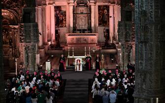 Pope Francis (C) celebrates vespers at the Jeronimos Monastery in Lisbon, during his five-day visit to attend the World Youth Day (WYD) gathering of young Catholics, on August 2, 2023. Pope Francis arrived in Lisbon today to gather with a million youngsters from across the world at the World Youth Day (WYD), held as the Church reflects on its future. The 86-year-old underwent major abdominal surgery just two months ago, but that has not stopped an event-packed 42nd trip abroad, with 11 speeches and around 20 meetings scheduled. (Photo by Marco BERTORELLO / AFP) (Photo by MARCO BERTORELLO/AFP via Getty Images)