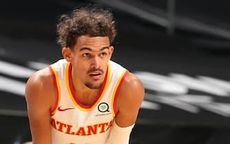 CHARLOTTE, NC - JANUARY 9: Trae Young #11 of the Atlanta Hawks looks on, on January 9, 2021 at Spectrum Center in Charlotte, North Carolina. NOTE TO USER: User expressly acknowledges and agrees that, by downloading and or using this photograph, User is consenting to the terms and conditions of the Getty Images License Agreement. Mandatory Copyright Notice: Copyright 2021 NBAE (Photo by Kent Smith/NBAE via Getty Images) 