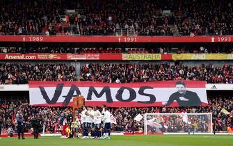 Arsenal and Leeds United players line up as fans hold up a banner for Arsenal manager Mikel Arteta during the Premier League match at the Emirates Stadium, London. Picture date: Saturday April 1, 2023. (Photo by Adam Davy/PA Images via Getty Images)
