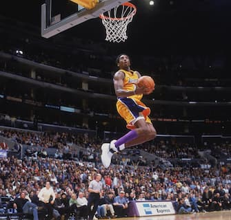 18 Nov 2001:  Guard Kobe Bryant #8 of the Los Angeles Lakers dunks the ball during the NBA game against the Sacramento Kings at the Staples Center in Los Angeles, California.  The Lakers defeated the Kings 93-85.  NOTE TO USER: User expressly acknowledges and agrees that, by downloading and/or using this Photograph, User is consenting to the terms and conditions of the Getty Images License Agreement. Mandatory copyright notice: Copyright 2001 NBAE Mandatory Credit: Robert Mora  /NBAE/Getty Images