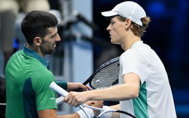 Jannik Sinner of Italy embraces Novak Djokovic of Serbia during the Nitto ATP Finals 2023 tennis tournament at the Pala Alpitour arena in Turin, Italy, 14 November 2023. ANSA/ALESSANDRO DI MARCO