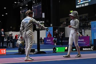 Ukraine's Olga Kharlan (L) refuses to shake hands with Russia's Anna Smirnova, registered as an Individual Neutral Athlete (AIN), after she defeated her during the Sabre Women's Senior Individual qualifiers, as part of the FIE Fencing World Championships at the Fair Allianz MI.CO (Milano Convegni) in Milan, on July 27, 2023. (Photo by Andreas SOLARO / AFP)