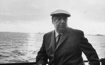 13th June 1966:  EXCLUSIVE Chilean poet and activist Pablo Neruda (1904 - 1973) leans on a ship's railing during the 34th annual PEN boat ride around New York City. He wears a cap.  (Photo by Sam Falk/New York Times Co./Getty Images)