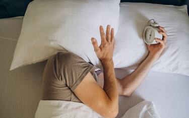 man does not want to wake up in the morning when the alarm goes off