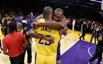 LOS ANGELES, CA - OCTOBER 26: LeBron James #23 of the Los Angeles Lakers embraces Kevin Durant #35 of the Phoenix Suns after the game on October 26, 2023 at Crypto.Com Arena in Los Angeles, California. NOTE TO USER: User expressly acknowledges and agrees that, by downloading and/or using this Photograph, user is consenting to the terms and conditions of the Getty Images License Agreement. Mandatory Copyright Notice: Copyright 2023 NBAE (Photo by Andrew D. Bernstein/NBAE via Getty Images) 

