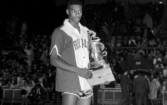 SYRACUSE, NY - 1961: Oscar Robertson #14 of the Cincinnati Royals is awarded the 1961 NBA All-Star MVP Trophy after the 1961 NBA All-Star Game circa 1961 in Syracuse, New York. NOTE TO USER: User expressly acknowledges and agrees that, by downloading and or using this photograph, User is consenting to the terms and conditions of the Getty Images License Agreement. Mandatory Copyright Notice: Copyright 1961 NBAE (Photo by The Stevenson Collection/NBAE via Getty Images)