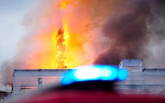 epa11281278 Flames and smoke rise from the old Stock Exchange (Boersen) in Copenhagen, Denmark, 16 April 2024.  EPA/Ida Marie Odgaard DENMARK OUT