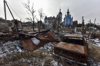 epa10487449 Destroyed vehicles outside the damaged women's monastery of the Mother Of God Joy Of All Who Sorrow in Bohorodychne, Donetsk region, eastern Ukraine, 24 February 2023. Russian troops entered Ukrainian territory on 24 February 2022, starting a conflict that has provoked destruction and a humanitarian crisis. One year on, fighting continues in many parts of the country.  EPA/OLEG PETRASYUK
