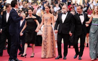 CANNES, FRANCE - MAY 21: (L-R) Sam Riley, a guest, Gabrielle Tana, Alicia Vikander, director Karim Aïnouz, Jude Law and Junia Rees attend the "Firebrand (Le Jeu De La Reine)" red carpet during the 76th annual Cannes film festival at Palais des Festivals on May 21, 2023 in Cannes, France. (Photo by Andreas Rentz/Getty Images)