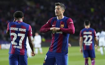 epa11217438 FC Barcelona's Robert Lewandowski celebrates after scoring the 3-1 goal during the UEFA Champions League round of 16 second leg soccer match between FC Barcelona and SSC Napoli, in Barcelona, Catalonia, Spain, 12 March 2024.  EPA/Alejandro Garcia