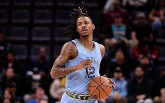 MEMPHIS, TENNESSEE - FEBRUARY 08: Ja Morant #12 of the Memphis Grizzlies brings the ball up court during the first half against the Los Angeles Clippers at FedExForum on February 08, 2022 in Memphis, Tennessee. NOTE TO USER: User expressly acknowledges and agrees that, by downloading and or using this photograph, User is consenting to the terms and conditions of the Getty Images License Agreement.  (Photo by Justin Ford/Getty Images)