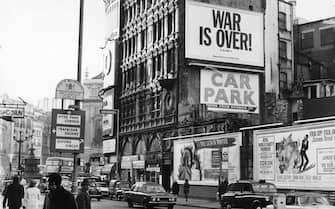 Among the posters for film and theatre at Piccadilly Circus in London is one from Beatle, John Lennon and his wife Yoko saying, 'War is Over ! If you want it. Happy Christmas from John and Yoko'.  (Photo by Alden Evening Standard/Getty Images)