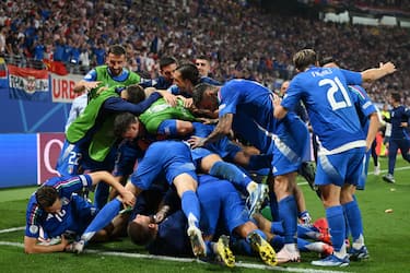 LEIPZIG, GERMANY - JUNE 24: Mattia Zaccagni of Italy celebrates with his teammates after scoring his team's first goal during the UEFA Euro 2024 group stage match between Croatia and Italy at RB Leipzig Football Stadium on June 24, 2024 in Leipzig, Germany.  (Photo by Claudio Villa/Getty Images for Italian Football Federation)