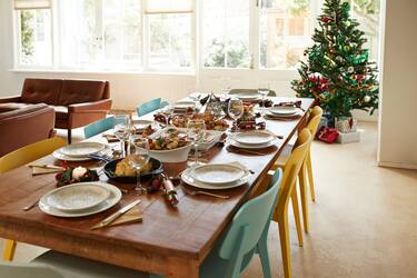 High angle view of food with wine served on dining table at home during Christmas