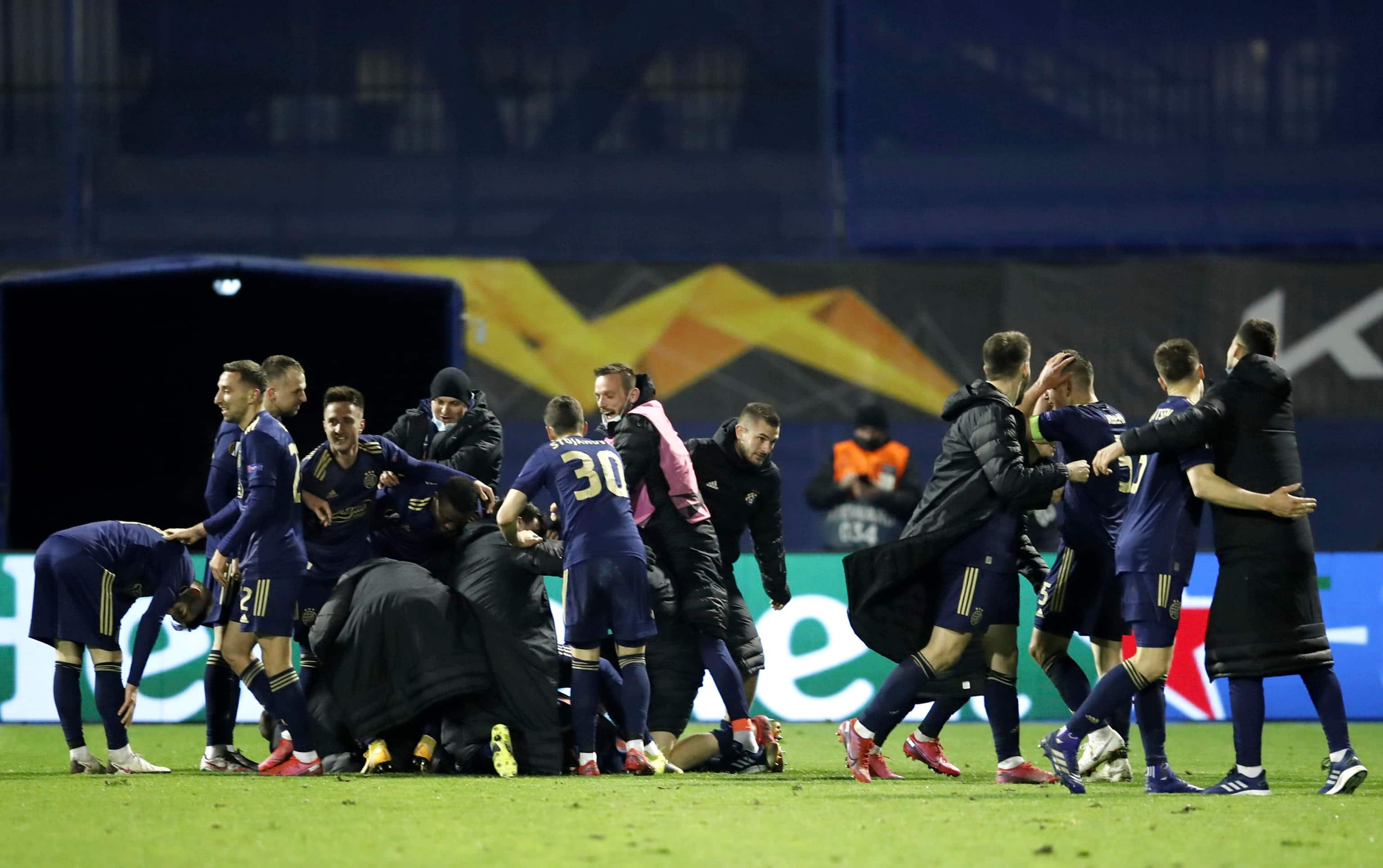 epa09082846 Players of Zagreb celebrate the 3-0 lead during the UEFA Europa League Round of 16, second leg match between Dinamo Zagreb and Tottenham Hotspur in Zagreb, Croatia, 18 March 2021.  EPA/ANTONIO BAT