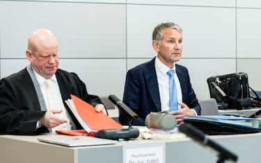 HALLE, GERMANY - APRIL 18: Bjoern Hoecke (R), a former history teacher and current leader of the far-right Alternative for Germany (AfD) political party in the state of Thuringia, and his lawyer Ulrich Vosgerau (L) arrive for the first day of his trial for using Nazi-era terminology on April 18, 2024 in Halle, Germany. Prosecutors accuse Hoecke of having concluded a political rally in Merseburg in 2021 by yelling out "Alles fuer Deutschland" ("Everything for Germany"), a slogan used by Nazi-era SA stormtroopers, the use of which is a felony in modern Germany. The state of Thuringia is among three eastern German states scheduled to hold state elections in September, and in all three the AfD is currently leading in polls.(Photo by Jens Schlueter/Getty Images)