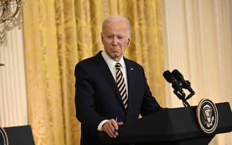 US President Joe Biden looks on during a press confereence with Ukraine's President Volodymyr Zelensky in the East Room of the White House in Washington, DC, on December 21, 2022. - US President Joe Biden told Ukrainian leader Volodymyr Zelensky after a meeting at the White House on Wednesday that Ukraine will "never stand alone." "Ukraine's fight is part of something much bigger," Biden said at a joint press conference with Zelensky by his side, pledging that the United States would lend its support against "Russian aggression" for "as long as it takes." (Photo by Brendan SMIALOWSKI / AFP)