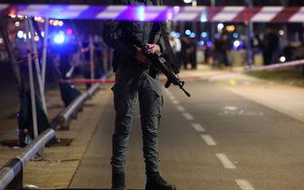 An Israeli policeman stands guard at the site of an attack in Tel Aviv on April 7, 2023. - One man was killed and four people were wounded in an attack in central Tel Aviv, Israeli rescue services said, updating a previous casualty toll of two injured. (Photo by AHMAD GHARABLI / AFP) (Photo by AHMAD GHARABLI/AFP via Getty Images)