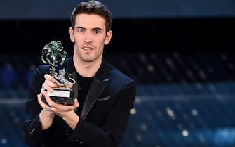 SANREMO, ITALY - FEBRUARY 13:  Italian singer Giovanni Caccamo, winner (Nuove Proposte) of the 65th Italian Music Festival in Sanremo, poses with his trophy at the Ariston theatre during the Fourth night on February 13, 2015 in Sanremo, Italy  (Photo by Venturelli/WireImage)