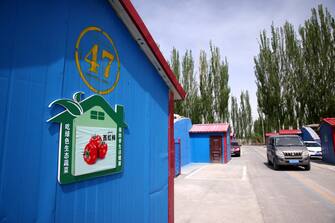 epa09147573 A tomato's nameplate is seen outside a greenhouse in Bageqi village of Aksu, western China's Xinjiang Uyghur Autonomous Region during a government organized trip for foreign journalists, 20 April 2021. Japanese ketchup producer Kagome has stopped importing tomatoes from China's Xinjiang, the company said on 14 April, joining the growing ranks of Western brands that have ceased sourcing materials from the region over reported abuses against Uyghur Muslims.  EPA/WU HONG