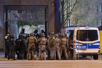 epa10512740 Armed police officers gather at the scene of a shooting in Hamburg, Germany, 09 March 2023. According to police, the shooting took place around 9 pm, killing seven people and injuring at least eight others. The gunman is believed to be among the several dead found in the building, police said.  EPA/NEWS5