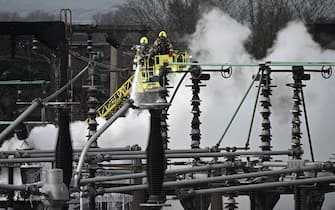 LONDON, ENGLAND - MARCH 21: Members of the Fire Brigade attend the scene following a major fire at an electrical substation at Heathrow on March 21, 2025 in London, England. A fire at the North Hyde electricity substation in Hayes has caused a significant power outage at Heathrow Airport leading to all flights in and out to be cancelled until midnight tonight affecting around 200,000 passengers. Some homes near to the fire have also been evacuated.   (Photo by Leon Neal/Getty Images)