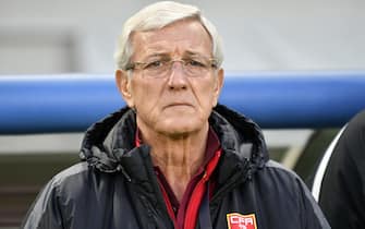 epa06392836 China's head coach Marcello Lippi of Italy looks on before the East Asian Football Federation (EAFF) E-1 Football championship 2017 men's match between China and North Korea in Tokyo, Japan, 16 December 2017.  EPA/FRANCK ROBICHON