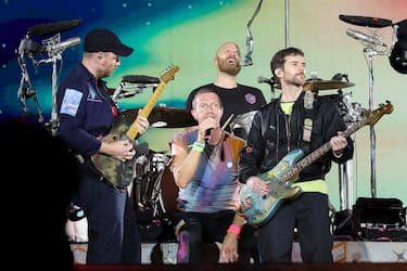 PASADENA, CALIFORNIA - SEPTEMBER 30: (L-R) Jonny Buckland, Chris Martin, Will Champion and Guy Berryman of Coldplay perform onstage at Rose Bowl Stadium on September 30, 2023 in Pasadena, California. (Photo by Monica Schipper/Getty Images)