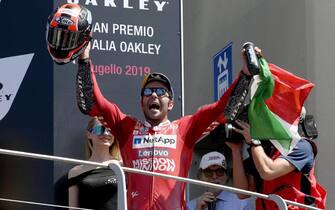 Italian Moto GP rider Danilo Petrucci of Ducati Team celebrates on the podium after winning  the Motorcycling Grand Prix of Italy at the Mugello circuit in Scarperia, central Italy, 2 June 2019
ANSA/CLAUDIO GIOVANNINI