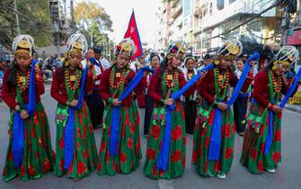 KATHMANDU, NEPAL-DECEMBER 31: Nepalese women from the Gurung community dressed in traditional attire dance as they take part in the parade to mark the Tamu Lhosar or New Year in Kathmandu, Nepal on December 31, 2023. (Photo by Sunil Pradhan/Anadolu via Getty Images)