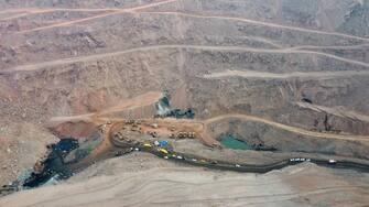 epa10484821 An aerial view of rescue vehicles working at the site of a collapsed coal mine in Alxa League, north China's Inner Mongolia Autonomous Region, 23 February 2023. The landslide occurred at the rescue site at around 6 p.m. China Standard Time (CST) on 22 February, according to the rescue headquarters. As of 23 February, more than 900 people had rushed to the site for rescue operations after an open-pit mine collapsed in Alxa Left Banner at around 1 p.m. CST on 22 February, resulting in two deaths, six injuries, and 53 people missing.  EPA/XINHUA/BEI HE CHINA OUT / MANDATORY CREDIT  EDITORIAL USE ONLY