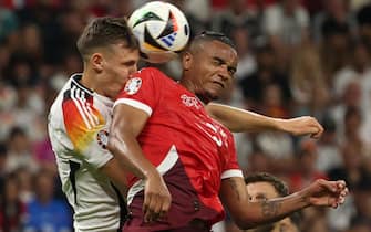epa11433161 Manuel Akanji of Switzerland (R) and Nico Schlotterbeck of Germany in action during the UEFA EURO 2024 group A soccer match between Switzerland and Germany, in Frankfurt am Main, Germany, 23 June 2024.  EPA/FRIEDEMANN VOGEL