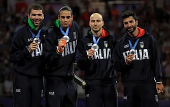 epa11526382 Silver medalists Guillaume Bianchi, Filippo Macchi, Tommaso Marini and Alessio Foconi of Italy celebrate during award ceremony for the Men Foil Team competition in the Paris 2024 Olympic Games, at the Grand Palais in Paris, France, 04 August 2024.  EPA/MARTIN DIVISEK