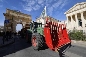 epa11105675 French farmers in tractors arrive to Montpellier to demonstrate in front of prefecture of Montpellier, France, 26 January 2024. French farmers continue their protests with road blockades and demonstrations in front of state buildings awaiting a response from the government to their request for  immediate  aid of several hundred million euros. On 23 January, the EU Agriculture and Fisheries Council highlighted the importance of providing the conditions necessary to enable EU farmers to ensure food security sustainably and profitably, as well as ensuring a fair income for farmers.  EPA/GUILLAUME HORCAJUELO