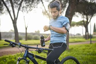 Young man using smart watch.