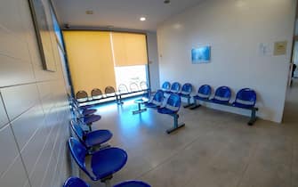 Huelva, Spain - March 9, 2022: Empty waiting room inside of almost empty health center due to coronavirus Covid-19