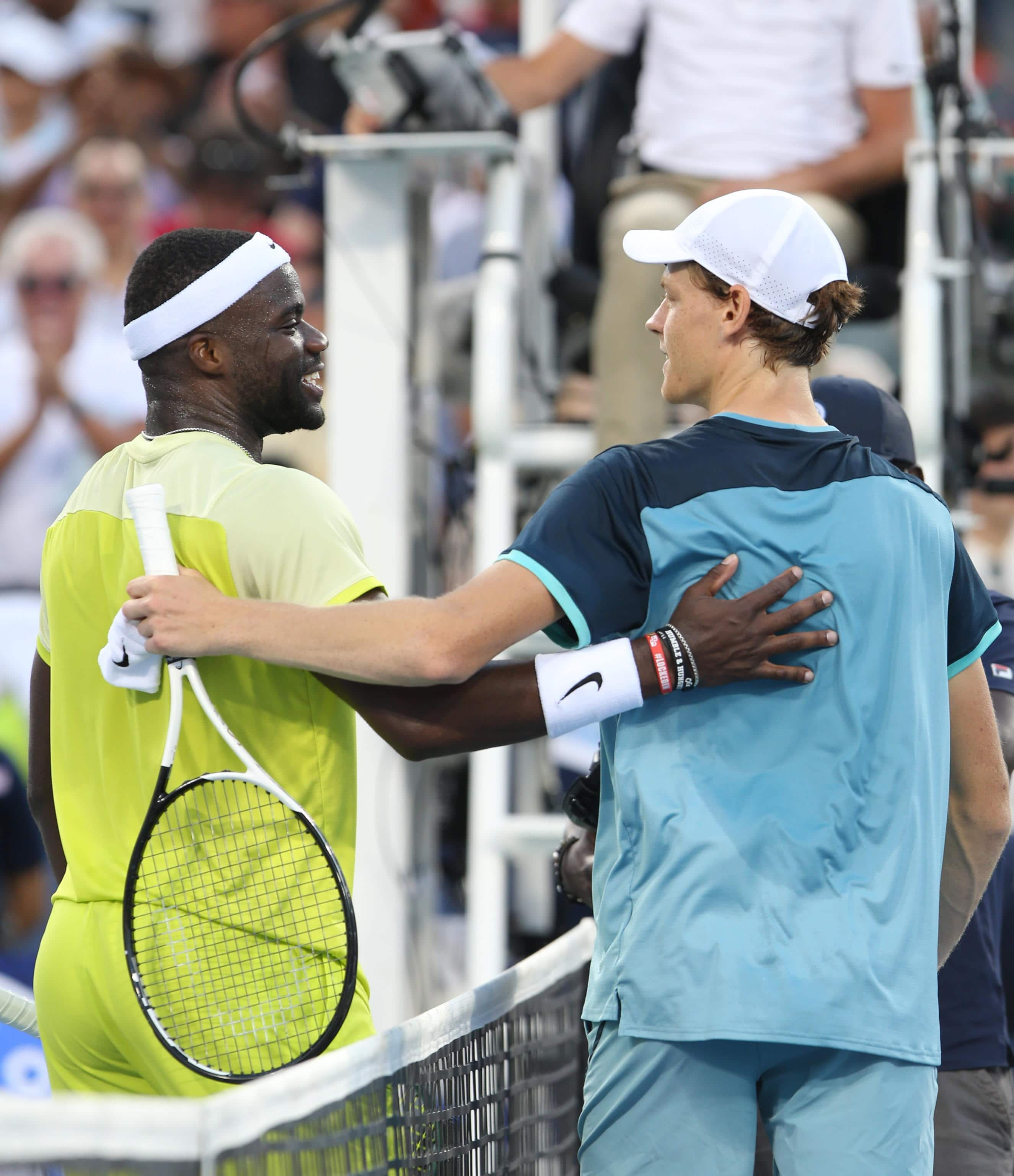 epa11555797 Jannik Sinner of Italy (R) congratulates Frances Tiafoe of the United States (L) after defeating Tiafoe in the finals of the Cincinnati Open in Mason, Ohio, USA, 19 August 2024.  EPA/MARK LYONS