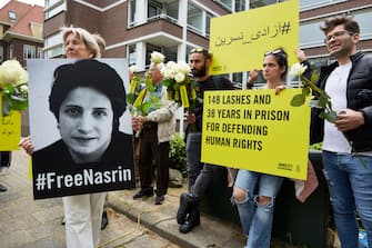 THE HAGUE, NETHERLANDS - MAY 31: Human Rights activists attend the birthday party of jailed Iranian Human Rights lawyer Nasrin Sotoudeh, outside the embassy of the Islamic Republic of Iran on May 31, 2019 in The Hague, Netherlands. Nasrin Sotoudeh has been sentenced in March to 38 years in prison and 148 lashes for protesting the death penalty and against the obligation to wear a headscarf. The birthday party organized by Amnesty International is a protest for her release. (Photo by Pierre Crom/Getty Images)