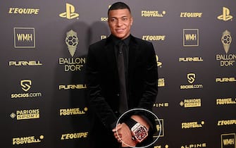 Paris Saint-Germain's French forward Kylian Mbappe poses upon arrival to attend  the 2021 Ballon d'Or France Football award ceremony at the Theatre du Chatelet in Paris on November 29, 2021. (Photo by Anne-Christine POUJOULAT / AFP) (Photo by ANNE-CHRISTINE POUJOULAT/AFP via Getty Images)