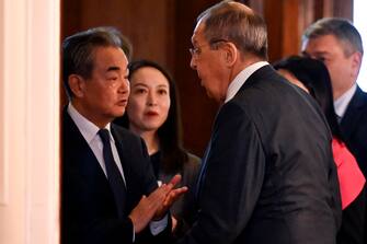 epa10483124 Russian Foreign Minister Sergei Lavrov (R) and China's Director of the Office of the Central Foreign Affairs Commission Wang Yi (L) talk to each other during a meeting in Moscow, Russia, 22 February 2023. Wang Yi arrived in Moscow on 21 February, and engaged in negotiations with the Secretary of the Security Council of the Russian Federation Nikolai Patrushev. At this meeting, Wang Yi stressed that Chinese-Russian relations are 'strong as a rock' and 'will stand the test in the changing international situation.' According to Wang Yi, Beijing is ready, together with Moscow, to resolutely defend national interests and promote mutually beneficial cooperation in all areas.  EPA/ALEXANDER NEMENOV / POOL