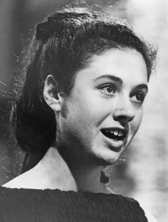 16 year-old Italian singer Gigliola Cinquetti singing the winning song, song 'Non ho l'eta', at the Eurovision Song Contest, held at the Tivolis Koncertsal, Copenhagen, 21st March 1964. (Photo by Keystone/Hulton Archive/Getty Images)